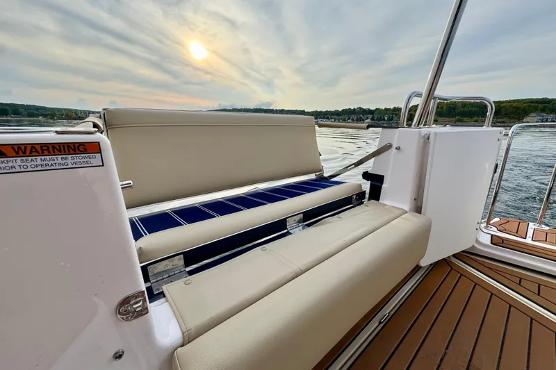  Yacht Photos Pics 2025 Ranger Tugs R-31 CB boat interior with seating and scenic water view.