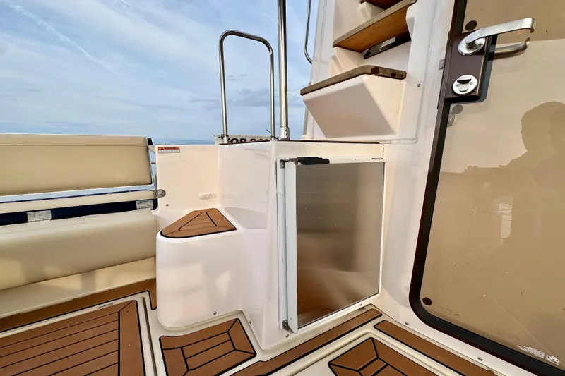  Yacht Photos Pics 2025 Ranger Tugs R-31 CB boat interior with seating, steps, and door.
