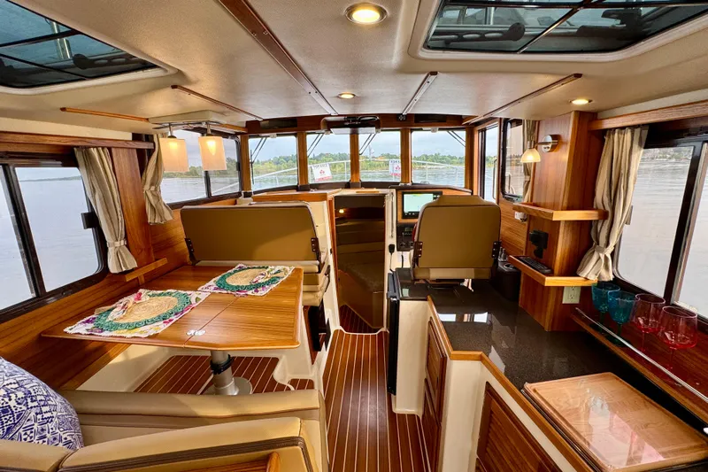  Yacht Photos Pics Luxurious interior of 2025 Ranger Tugs R-31 CB with elegant wood finishes and modern amenities.