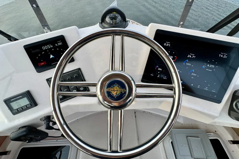  Yacht Photos Pics 2025 Ranger Tugs R-31 CB helm with modern navigation displays and controls.