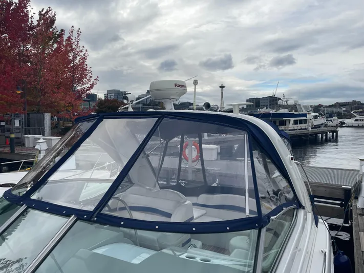  Yacht Photos Pics 2003 Formula 37 PC boat docked at marina with cityscape and autumn trees in background.