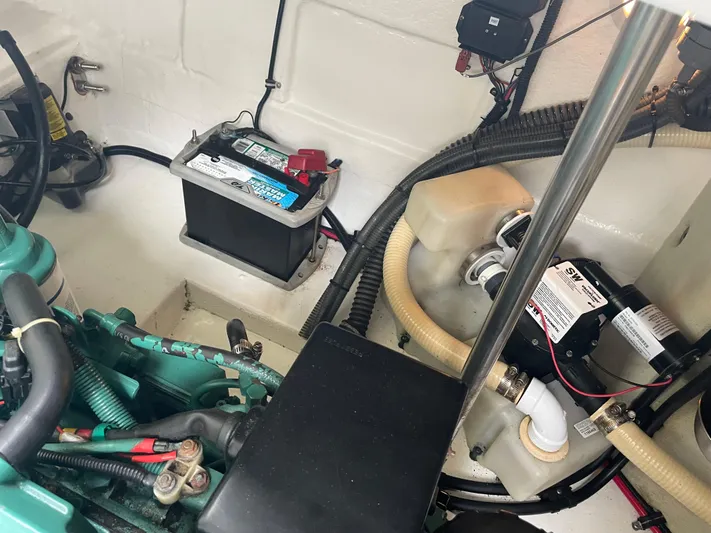  Yacht Photos Pics Engine compartment of a 2003 Formula 37 PC boat, featuring battery and wiring components.