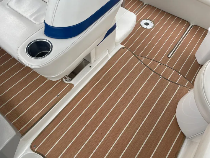  Yacht Photos Pics 2003 Formula 37 PC boat interior with striped flooring and white seating.