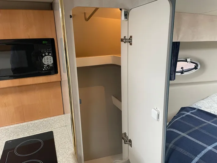  Yacht Photos Pics Interior of 2003 Formula 37 PC yacht with kitchenette and open closet.