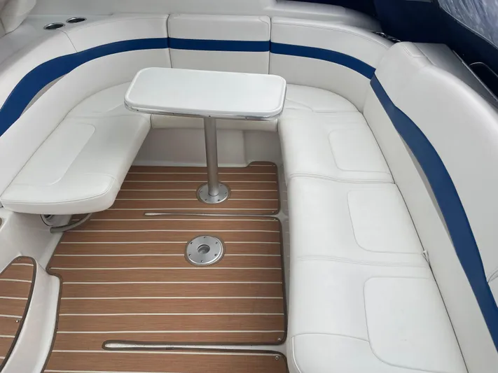  Yacht Photos Pics 2003 Formula 37 PC boat interior with white seating and wooden flooring.