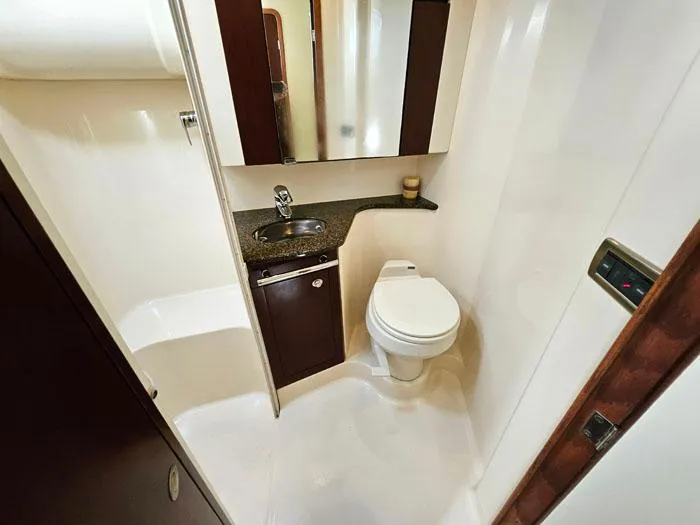  Yacht Photos Pics Bathroom interior of 2006 Sea Ray 44 Sedan Bridge yacht, featuring sink and toilet.