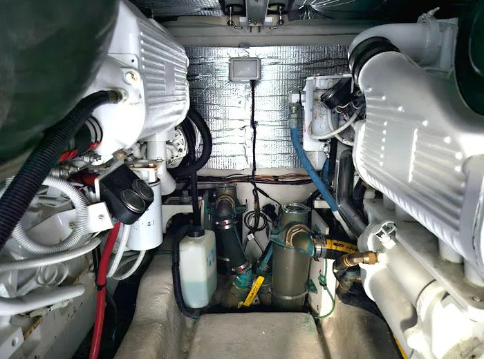  Yacht Photos Pics Engine room of a 2006 Sea Ray 44 Sedan Bridge yacht, showcasing mechanical components.