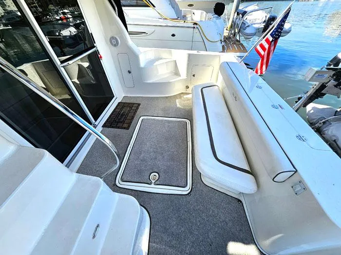  Yacht Photos Pics 2006 Sea Ray 44 Sedan Bridge yacht deck with seating and American flag.