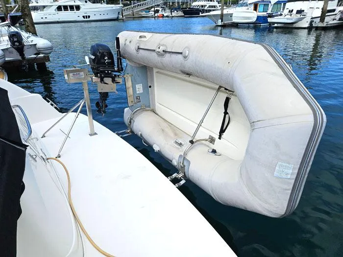  Yacht Photos Pics Inflatable dinghy attached to a 2006 Sea Ray 44 Sedan Bridge yacht in a marina.