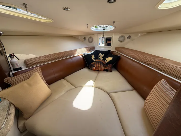  Yacht Photos Pics 2008 Hydra-Sports Vector 3500 VX cabin interior with cozy seating and decorative pillows.