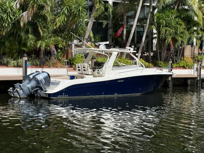  Yacht Photos Pics 2008 Hydra-Sports Vector 3500 VX boat docked by lush greenery.