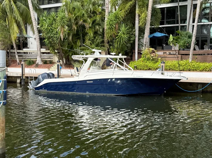  Yacht Photos Pics 2008 Hydra-Sports Vector 3500 VX boat docked by lush greenery.
