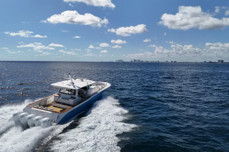 Yacht Photos Pics 2021 HCB 65 Estrella cruising on open ocean under clear blue sky.