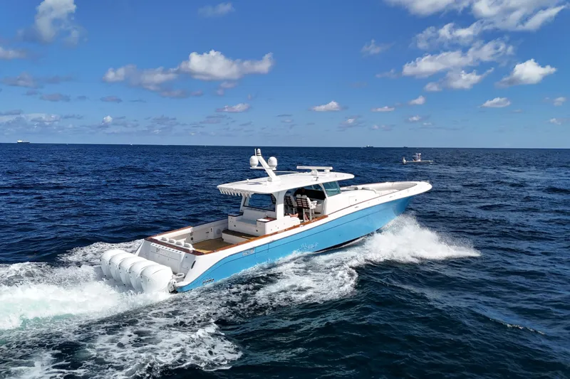 Yacht Photos Pics 2021 HCB 65 Estrella yacht cruising on open ocean under blue sky.
