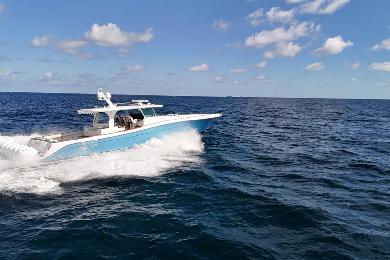  Yacht Photos Pics 2021 HCB 65 Estrella yacht cruising on open ocean under blue sky.