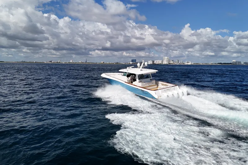  Yacht Photos Pics 2021 HCB 65 Estrella cruising on open water under a partly cloudy sky.