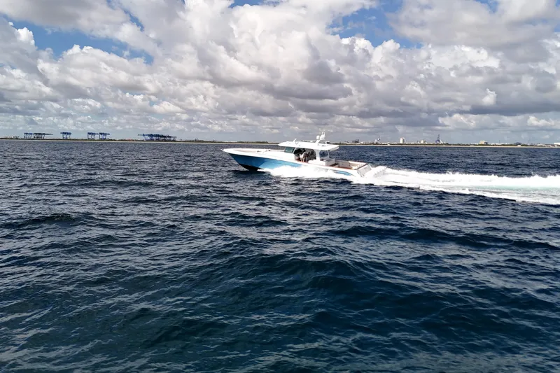  Yacht Photos Pics 2021 HCB 65 Estrella cruising on open water under cloudy skies.