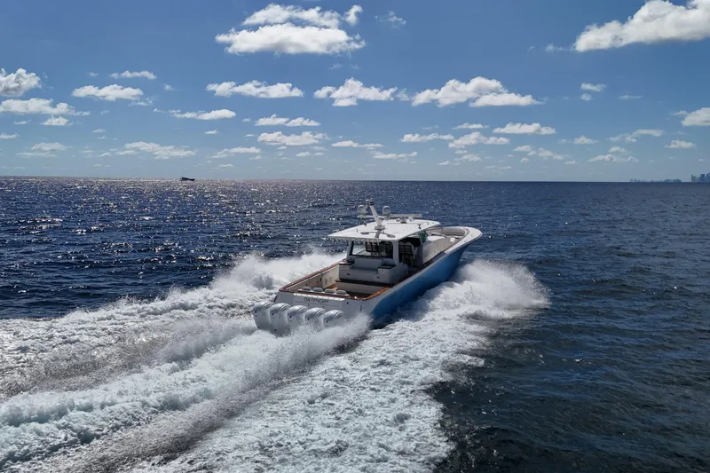  Yacht Photos Pics 2021 HCB 65 Estrella cruising on open ocean under clear blue sky.