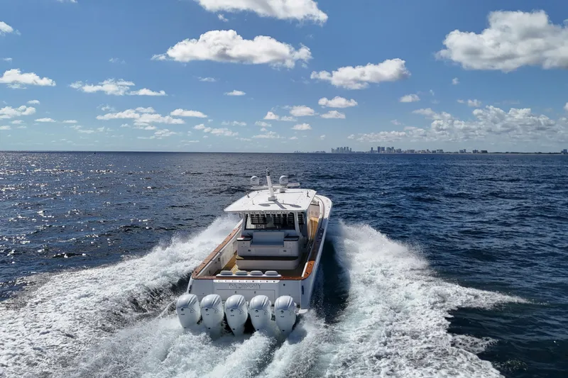  Yacht Photos Pics 2021 HCB 65 Estrella cruising on open ocean under clear blue sky.