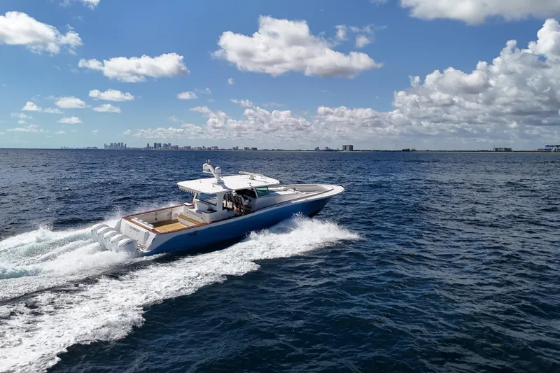  Yacht Photos Pics 2021 HCB 65 Estrella cruising on open water under a clear blue sky.