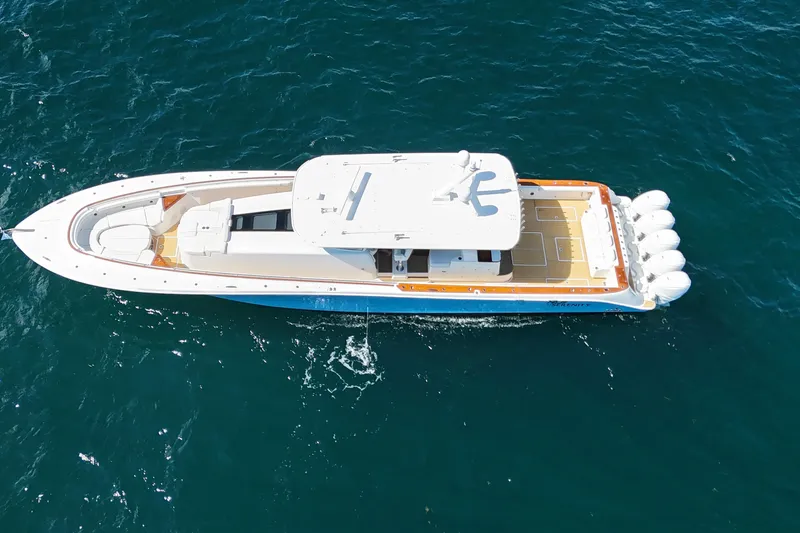  Yacht Photos Pics Aerial view of 2021 HCB 65 Estrella luxury yacht cruising on open water.