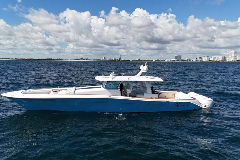  Yacht Photos Pics 2021 HCB 65 Estrella boat on open water under a partly cloudy sky.