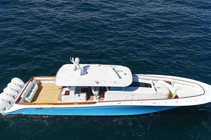  Yacht Photos Pics 2021 HCB 65 Estrella luxury yacht cruising on open water, aerial view.