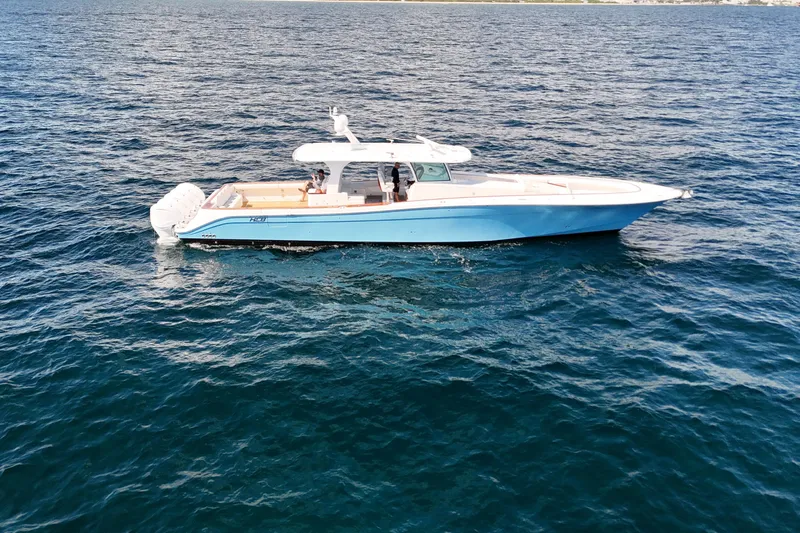 Yacht Photos Pics 2021 HCB 65 Estrella boat on open water, featuring sleek design and blue hull.