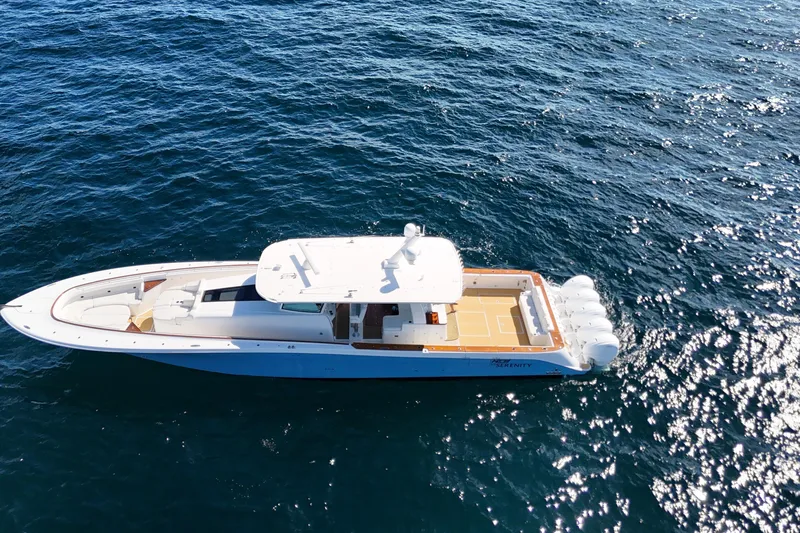 Yacht Photos Pics Aerial view of 2021 HCB 65 Estrella yacht cruising on open water.