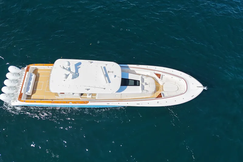  Yacht Photos Pics Aerial view of 2021 HCB 65 Estrella luxury yacht cruising on open water.