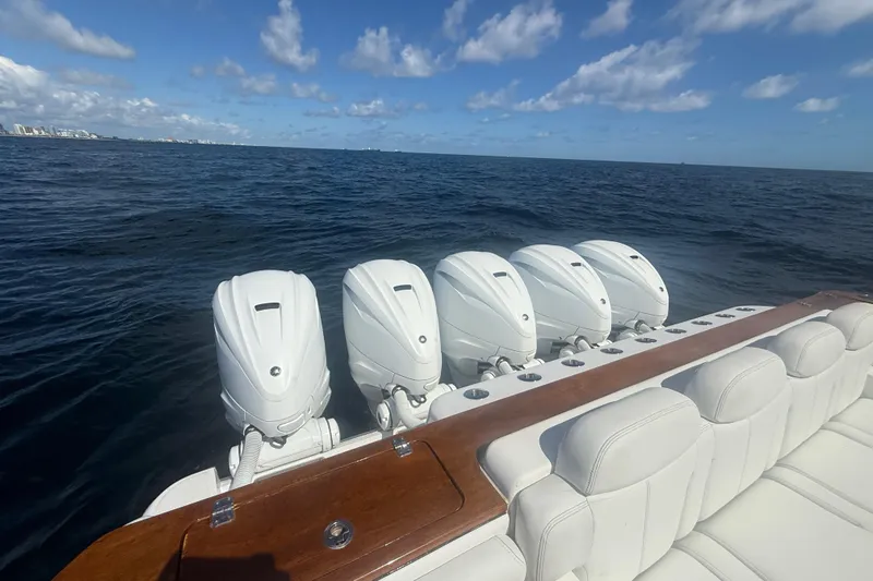  Yacht Photos Pics 2021 HCB 65 Estrella boat with five powerful outboard engines on open sea.