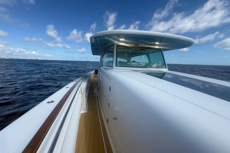  Yacht Photos Pics 2021 HCB 65 Estrella yacht cruising on open sea under blue sky.