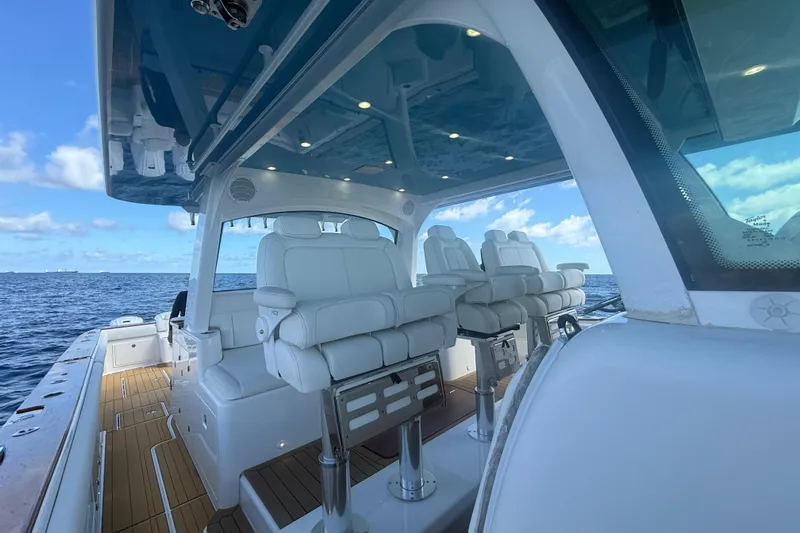  Yacht Photos Pics 2021 HCB 65 Estrella luxury boat interior with white seating and ocean view.