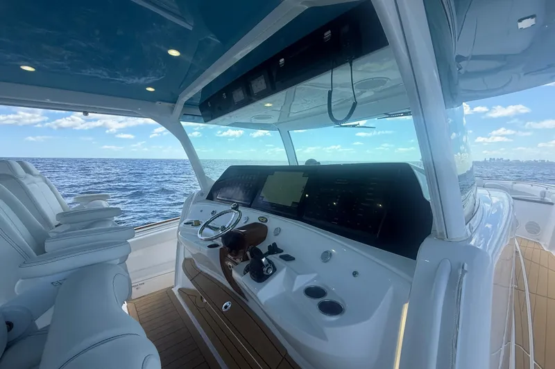  Yacht Photos Pics 2021 HCB 65 Estrella yacht helm with ocean view, featuring modern controls and seating.