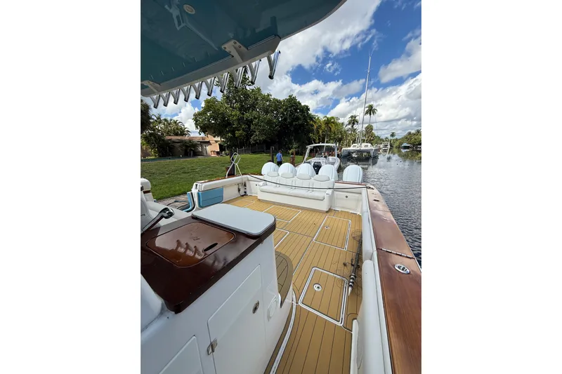  Yacht Photos Pics Luxurious 2021 HCB 65 boat with spacious deck and scenic waterfront view.