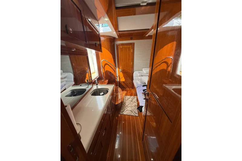  Yacht Photos Pics Luxurious 2021 HCB 65 yacht interior with polished wood finishes and modern amenities.