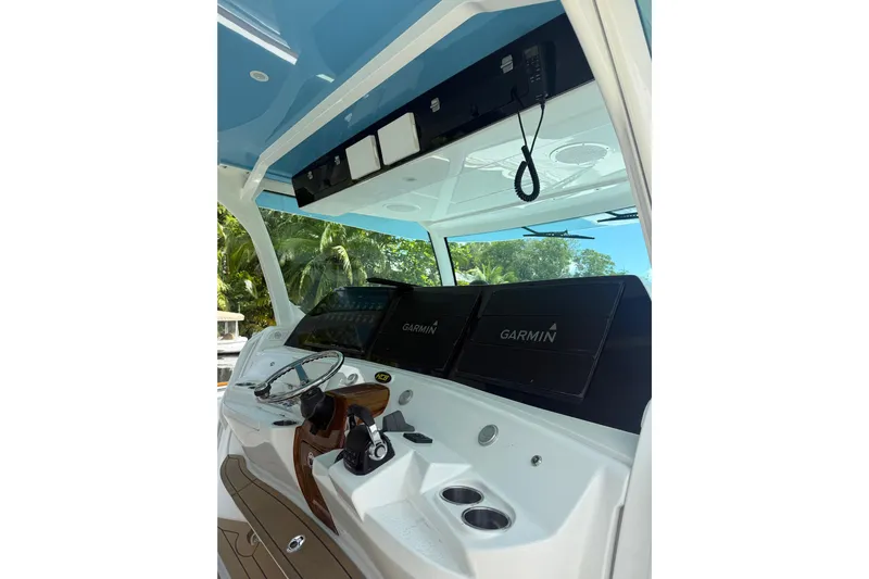  Yacht Photos Pics Helm of 2021 HCB 65 boat with Garmin navigation displays and steering wheel.