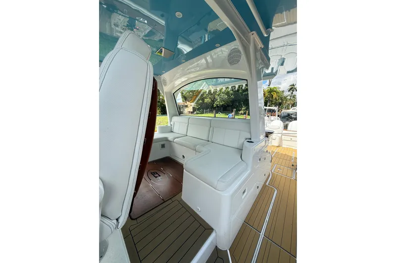  Yacht Photos Pics Luxurious interior of 2021 HCB 65 boat with white seating and wooden flooring.