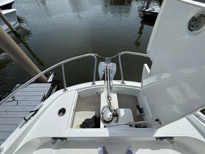 Eleven Eleven Yacht Photos Pics Bow view of 2022 Beneteau Gran Turismo 32 with anchor and open storage compartment.