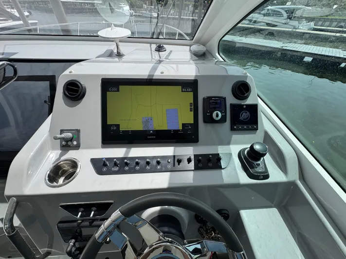 Eleven Eleven Yacht Photos Pics Control panel of 2022 Beneteau Gran Turismo 32 yacht with navigation display and controls.