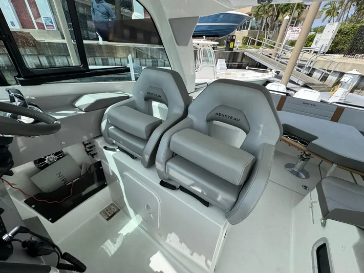 Eleven Eleven Yacht Photos Pics Interior of 2022 Beneteau Gran Turismo 32 yacht with modern seating and helm.