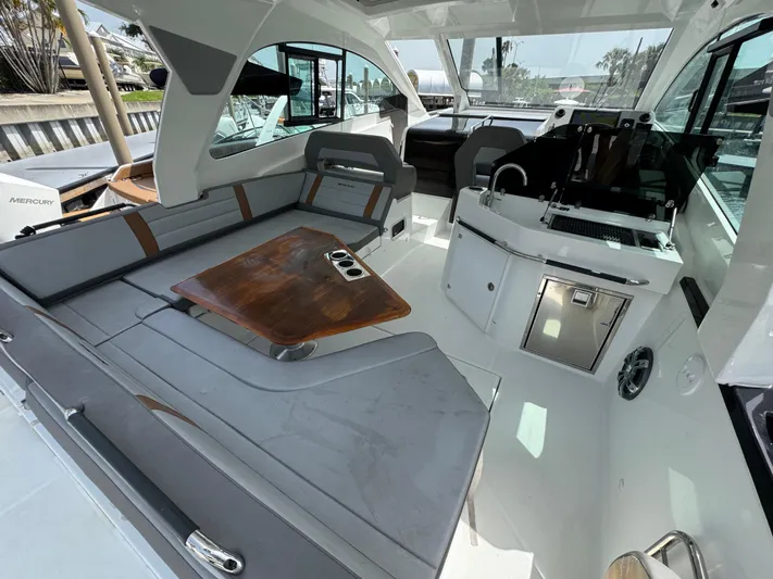 Eleven Eleven Yacht Photos Pics Interior of 2022 Beneteau Gran Turismo 32 yacht with modern seating and sleek design.
