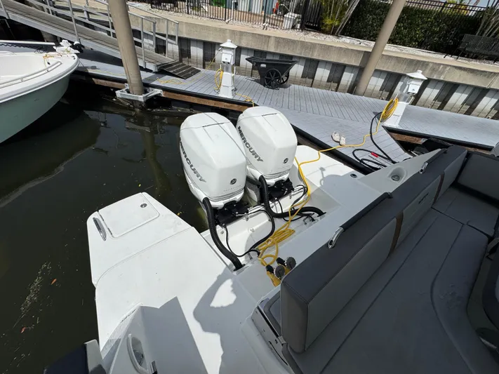 Eleven Eleven Yacht Photos Pics 2022 Beneteau Gran Turismo 32 with dual outboard engines docked at marina.