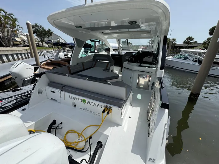 Eleven Eleven Yacht Photos Pics 2022 Beneteau Gran Turismo 32 yacht docked, featuring spacious seating and modern design.