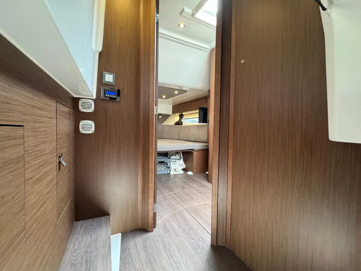 Eleven Eleven Yacht Photos Pics Interior view of 2022 Beneteau Gran Turismo 32 yacht, featuring wood paneling and modern design.