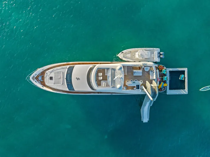 Current Sea Yacht Photos Pics Aerial view of 2011 Princess 95 Motor Yacht on turquoise water.
