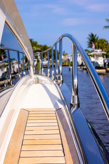  Yacht Photos Pics 2009 Marquis 500 Sport Coupe yacht docked at a marina.