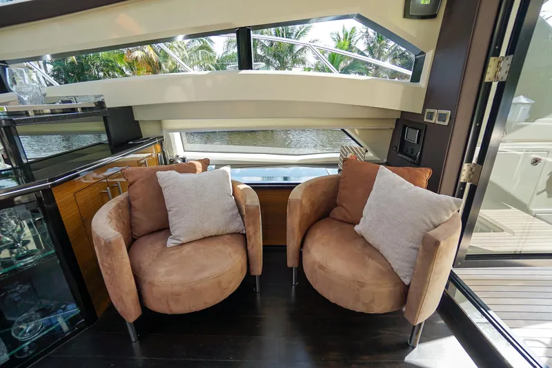  Yacht Photos Pics Interior of 2009 Marquis 500 Sport Coupe with two beige armchairs.