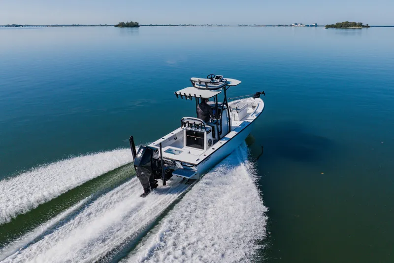  Yacht Photos Pics 2024 Dorado 25 boat cruising on calm water, showcasing sleek design and powerful performance.