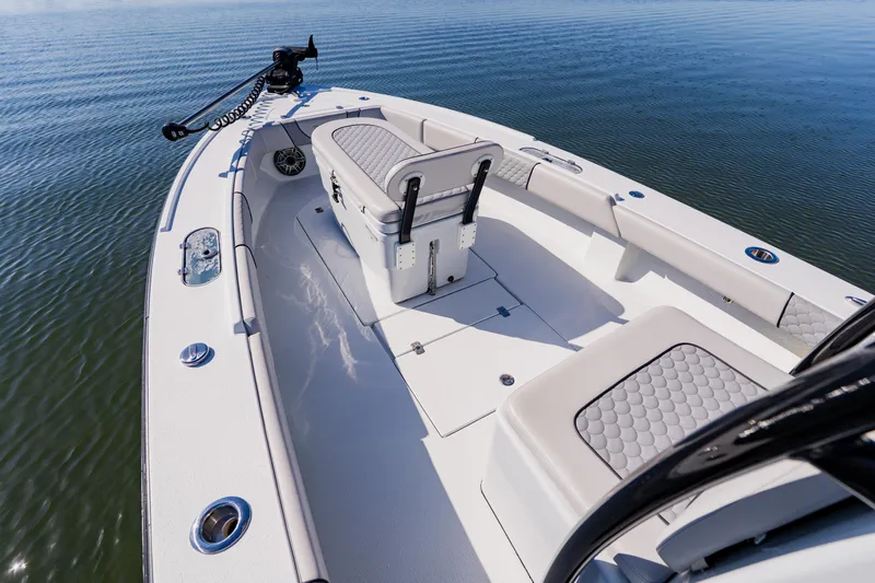  Yacht Photos Pics 2024 Dorado 25 boat interior with seating, on calm water.